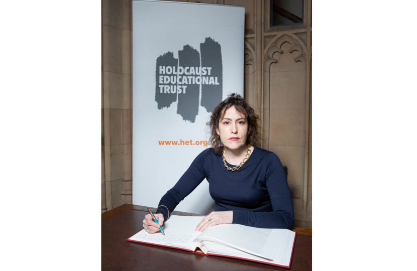 Victoria Atkins signing the Holocaust Book of Commitment