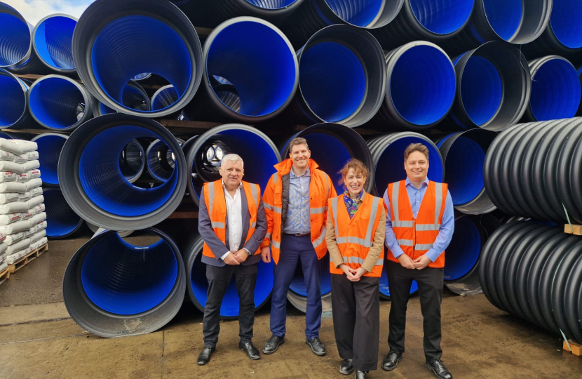 Victoria in front of pipes with Polypipe Staff