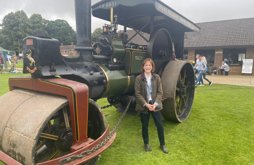 Victoria at the show next to a steam engine