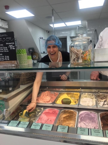 Victoria Atkins MP scoops a tub of award-winning Baci's ice cream