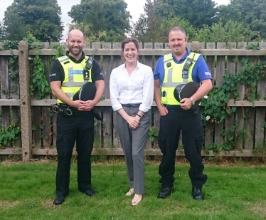 Victoria with police officers