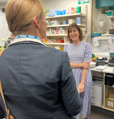 Victoria in conversation at Louth Pharmacy with Dr Latham-Green.